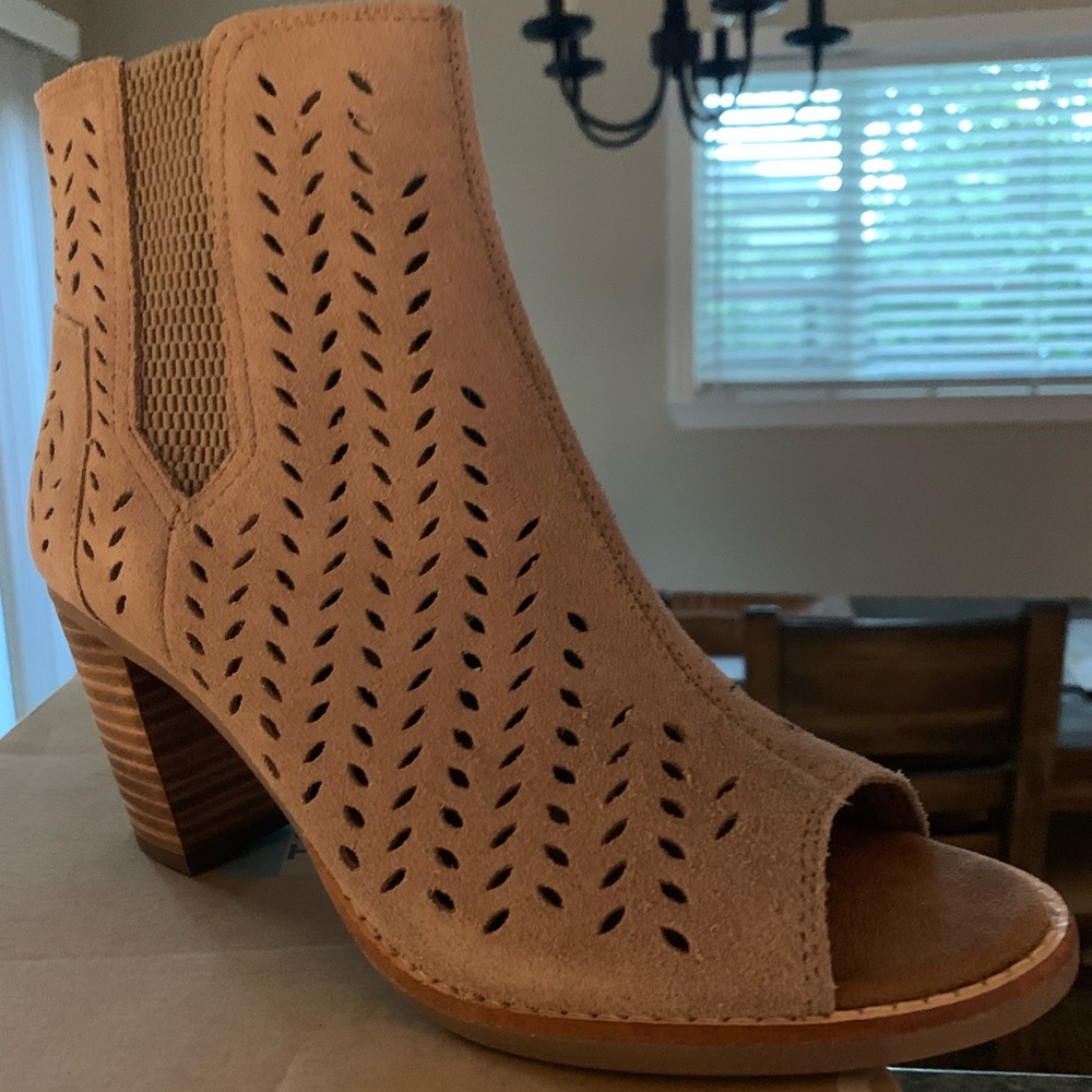 Toms new shoes with box.